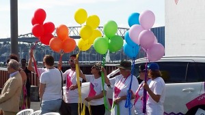 P2P volunteers release the rainbow balloons.