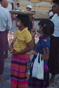 girl with plate of food on head